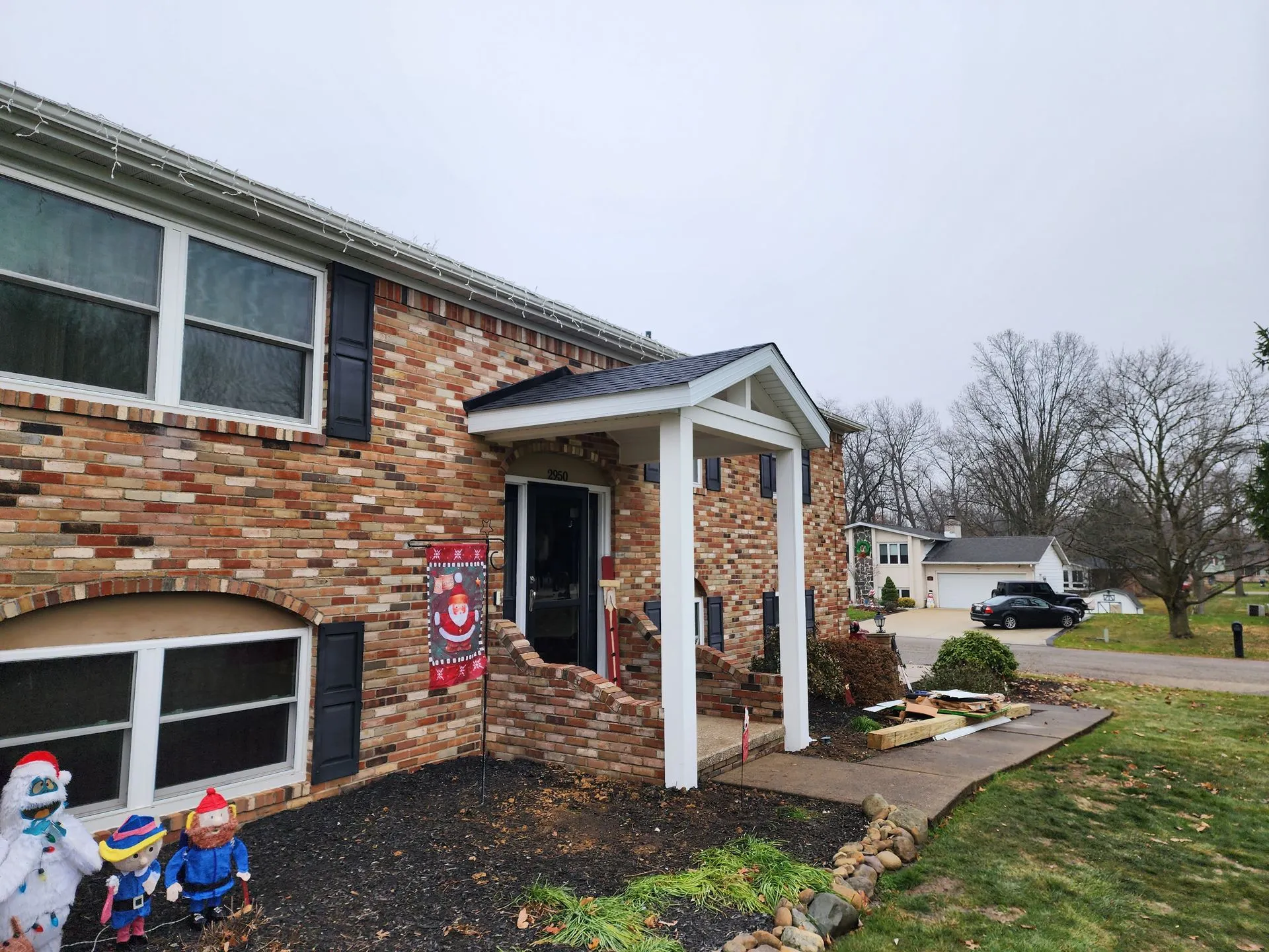 Residential home with new covered porch roof in Jackson Township