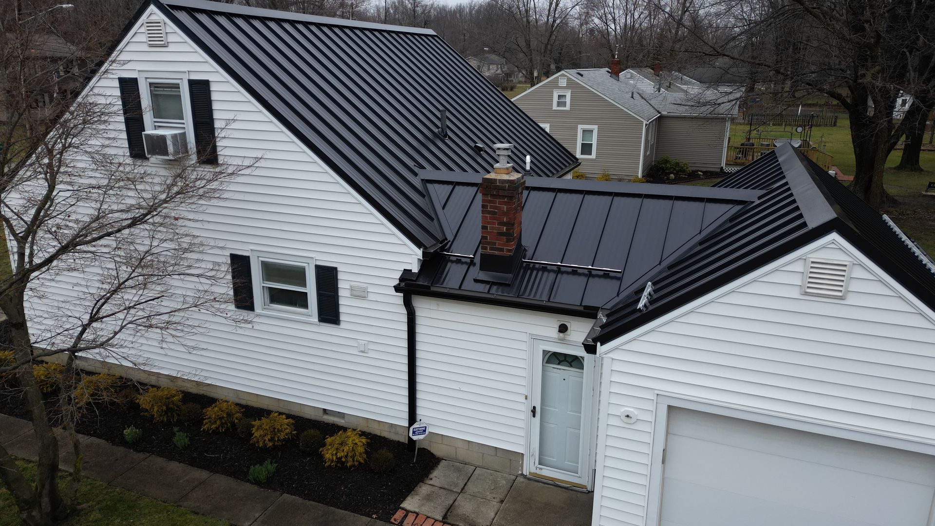 metal roof and gutter system installation on a residential home in  Uniontown