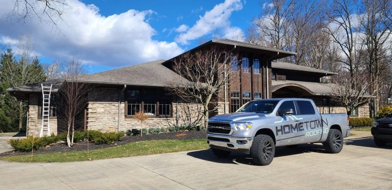 Hometown Roofing truck on-site at a residential roofing project in Ohio, highlighting professional installation, durable materials, and trusted local service.