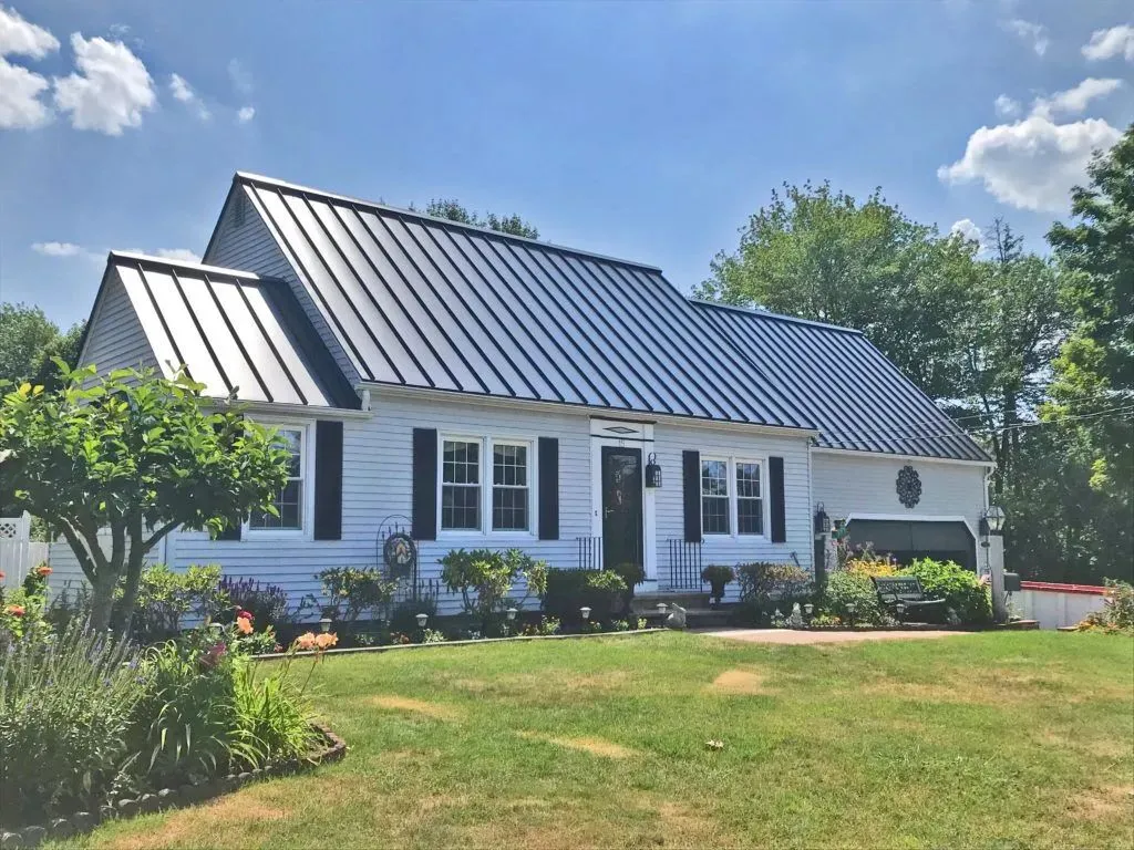 Residential home in Northeast Ohio with a standing seam metal roof, showcasing clean panel lines, proper flashing, and long-lasting metal roofing installation.