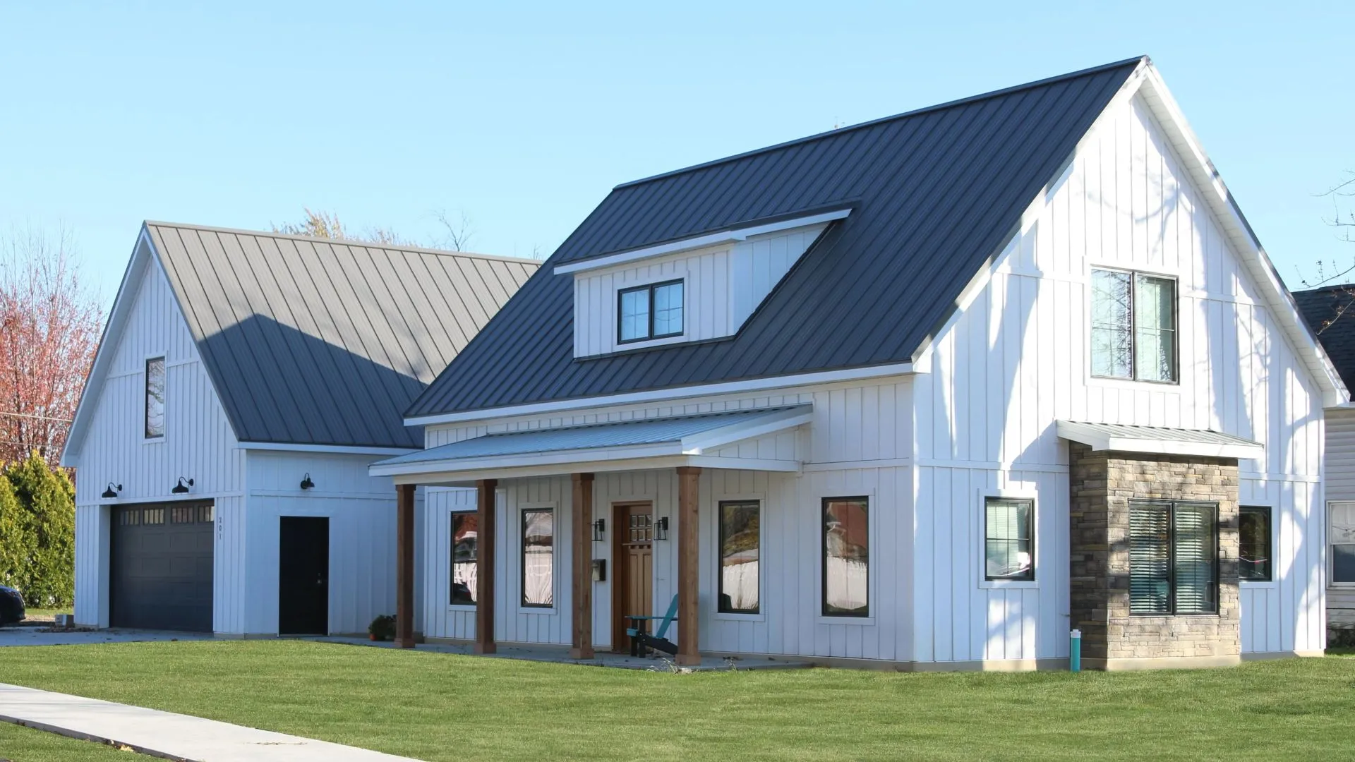 Residential home featuring a standing seam metal roof with clean panel alignment, ridge detailing, and durable metal roofing system.