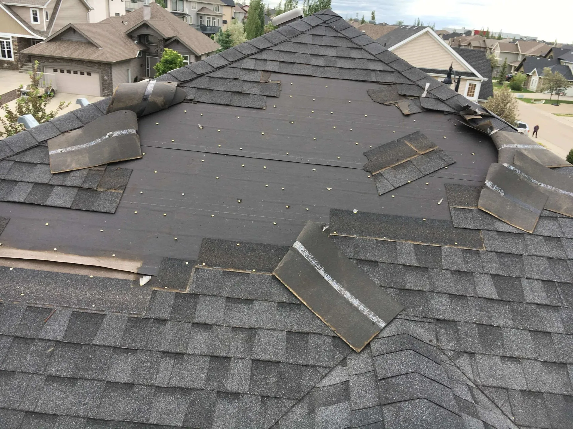damaged shingle roof in Kent, OH