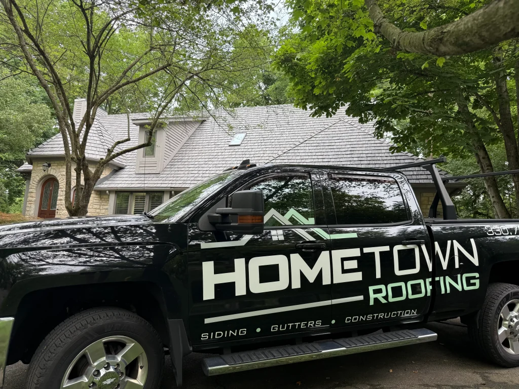 Hometown Roofing truck in front of a home in Muirfield Village with a new Brava tile roof.